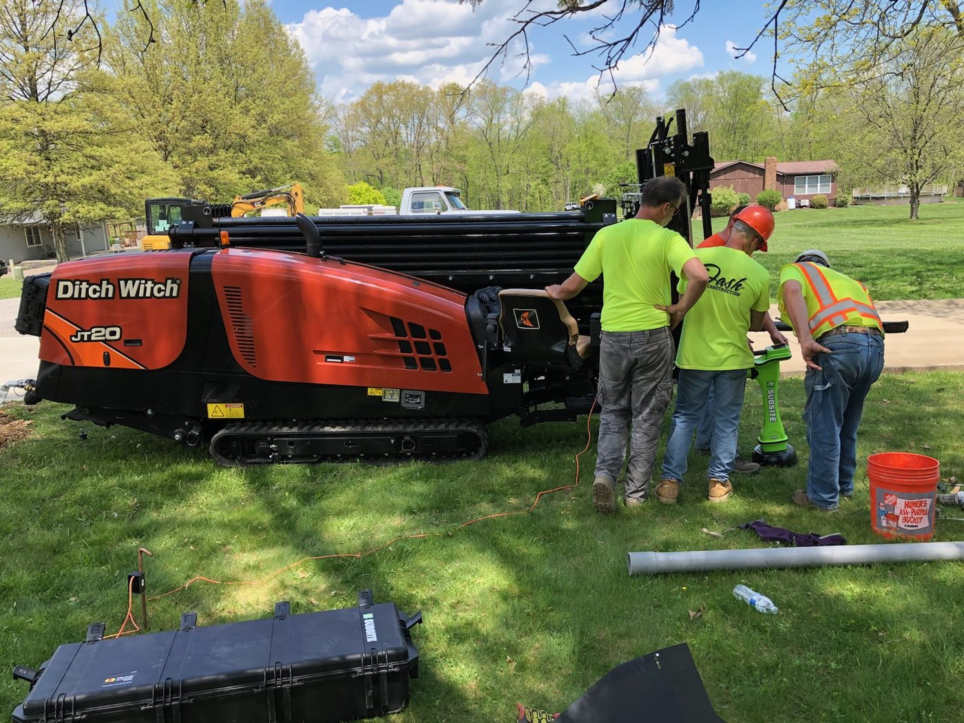 Ditch Witch horizontal directional drilling rig set up on a residential job site